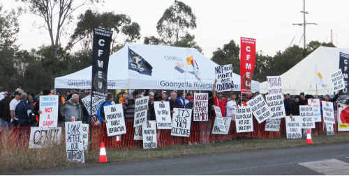 More than 300 workers waved signs at the union protest line near Moranbah on Wednesday morning. More than 300 workers waved signs at the union protest line near Moranbah on Wednesday morning.